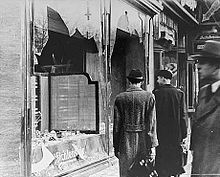 https://upload.wikimedia.org/wikipedia/commons/thumb/0/06/The_day_after_Kristallnacht.jpg/220px-The_day_after_Kristallnacht.jpg
